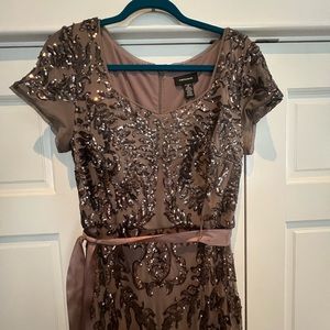 Elegant dress worn once.  Beautiful sequence and multi textured